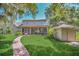 House back view with shed and walkway at 21113 Kissimmee Shores Rd, Lake Wales, FL 33898