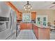 Kitchen boasts granite countertops, stainless steel appliances, and wood cabinets at 21113 Kissimmee Shores Rd, Lake Wales, FL 33898