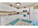 Well-equipped kitchen with white cabinets and granite countertops at 21113 Kissimmee Shores Rd, Lake Wales, FL 33898