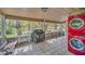 Screened porch with washer, dryer, and grill at 21113 Kissimmee Shores Rd, Lake Wales, FL 33898