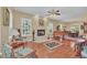 Spacious living room featuring hardwood floors and a fireplace at 21113 Kissimmee Shores Rd, Lake Wales, FL 33898