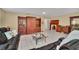 Living room features dark brown leather sectional and wood furniture at 21113 Kissimmee Shores Rd, Lake Wales, FL 33898