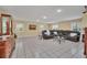 Spacious living room with a large sectional sofa and tile floors at 21113 Kissimmee Shores Rd, Lake Wales, FL 33898