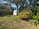 Large backyard with a shed and mature trees at 229 Ne Avenue J Ne, Winter Haven, FL 33881