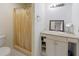 Bathroom with shower, vanity, and granite countertop at 2330 Park Ave, Indian Lake Estates, FL 33855
