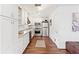 Modern kitchen with white cabinets and stainless steel appliances at 2330 Park Ave, Indian Lake Estates, FL 33855