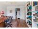 Home office with wood desk, built-in shelving and closet at 2330 Park Ave, Indian Lake Estates, FL 33855