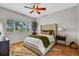 Comfortable bedroom with a plush bed, large window, and ceiling fan at 2739 Rutledge Ct, Winter Haven, FL 33884
