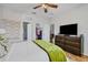 Relaxing bedroom with a king-size bed, walk-in closet, and TV at 2739 Rutledge Ct, Winter Haven, FL 33884