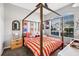Charming bedroom with a canopy bed, colorful bedding, and stylish decor at 2739 Rutledge Ct, Winter Haven, FL 33884