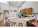 Modern kitchen with breakfast bar and wood cabinets at 2739 Rutledge Ct, Winter Haven, FL 33884