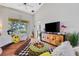 Spacious living room with leather couch, large TV, and stylish decor at 2739 Rutledge Ct, Winter Haven, FL 33884