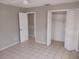 Simple bedroom with tile floors and closet at 2790 Avenue L Nw, Winter Haven, FL 33881