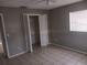 Simple bedroom with tile floors and closet at 2790 Avenue L Nw, Winter Haven, FL 33881