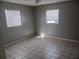 Bright bedroom with tile floors and ceiling fan at 2790 Avenue L Nw, Winter Haven, FL 33881