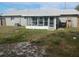 Back of house with screened porch and AC unit at 2790 Avenue L Nw, Winter Haven, FL 33881