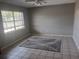Bright living room featuring tile floors and a large window at 2790 Avenue L Nw, Winter Haven, FL 33881