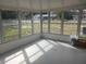 Bright screened porch with view of backyard at 2790 Avenue L Nw, Winter Haven, FL 33881