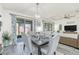 Bright dining room with a chandelier and seating for six at 2821 Mead Ave, St Cloud, FL 34771