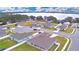 Aerial shot of new construction homes with lake views, manicured lawns and community street access at 304 Denna Ln, Auburndale, FL 33823