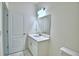 Bright bathroom with white vanity, lighting, and flooring at 304 Denna Ln, Auburndale, FL 33823