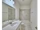 Bright bathroom features a granite countertop, tile flooring and a bathtub and shower combo at 304 Denna Ln, Auburndale, FL 33823