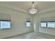 Bright bedroom featuring hardwood-style floors, neutral walls, and recessed ceilings at 304 Denna Ln, Auburndale, FL 33823