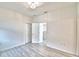 Well-lit bedroom featuring vinyl flooring and a closet at 304 Denna Ln, Auburndale, FL 33823