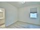 Bright bedroom features new laminate flooring and a sunny window at 304 Denna Ln, Auburndale, FL 33823