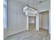 Dining room with hardwood floors, modern lighting, and an open doorway to the home at 304 Denna Ln, Auburndale, FL 33823