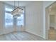 Bright dining room with chandelier and view into another room at 304 Denna Ln, Auburndale, FL 33823