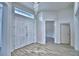 Bright and spacious entryway with light gray wood-look floors at 304 Denna Ln, Auburndale, FL 33823