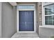 Modern double front doors and a simple entryway at 304 Denna Ln, Auburndale, FL 33823