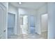 Hallway featuring doors to bedrooms and bathrooms at 304 Denna Ln, Auburndale, FL 33823