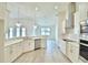 Open concept kitchen featuring a large island and breakfast bar at 304 Denna Ln, Auburndale, FL 33823