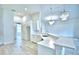 Bright kitchen with white countertops, stainless steel appliances, and modern fixtures at 304 Denna Ln, Auburndale, FL 33823