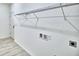 A laundry room featuring built-in wire shelving for easy storage and vinyl flooring at 304 Denna Ln, Auburndale, FL 33823