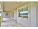 Covered patio featuring ample space for seating and entertainment with views of backyard at 304 Denna Ln, Auburndale, FL 33823