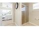 Bathroom with shower and view into bedroom at 3445 Raleigh Dr, Winter Haven, FL 33884