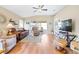 Living room with hardwood floors, ceiling fan, and comfortable seating at 3445 Raleigh Dr, Winter Haven, FL 33884