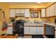 Kitchen with updated appliances, white cabinetry, and plenty of counter space for meal preparation at 3746 Red Oak Ct, Lake Wales, FL 33898
