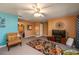 Living room with TV, comfortable seating, and carpet at 3746 Red Oak Ct, Lake Wales, FL 33898