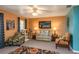 Cozy living room with armchairs, floral rug, and stylish decor offering a comfortable space at 3746 Red Oak Ct, Lake Wales, FL 33898