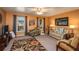Cozy living room with armchairs, floral rug, and stylish decor offering a comfortable space at 3746 Red Oak Ct, Lake Wales, FL 33898