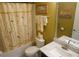 Small bathroom with tub shower, toilet, and vanity at 3926 Bedford Ave, Winter Haven, FL 33884