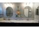 Double vanity bathroom with marble countertop and large mirrors at 3926 Bedford Ave, Winter Haven, FL 33884