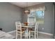 Cozy dining area with bright lighting and a view to the outside at 3926 Bedford Ave, Winter Haven, FL 33884