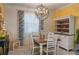 Inviting dining room with stylish chandelier, and elegant dining set at 3926 Bedford Ave, Winter Haven, FL 33884