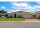 Charming single-story home with a well-manicured lawn and brick driveway at 3926 Bedford Ave, Winter Haven, FL 33884