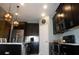 Spacious kitchen with dark cabinets, granite counters, and stainless steel appliances at 3926 Bedford Ave, Winter Haven, FL 33884